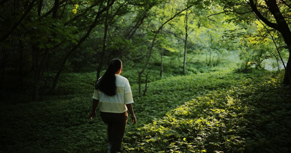 Hiker walking a forest trail without GPS signal